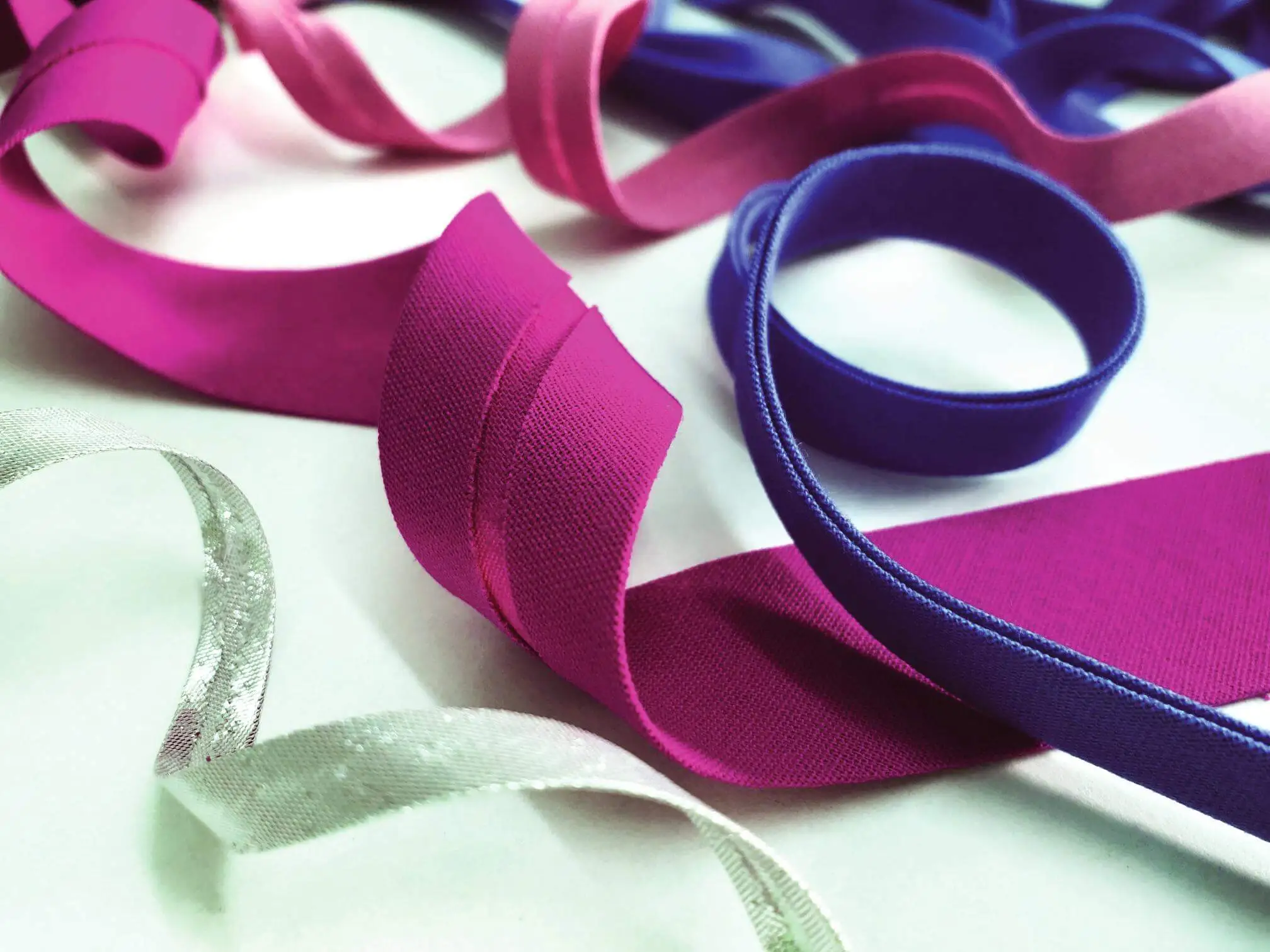 Rolls of colourful ribbon and trim on the Ebony Craft shelves